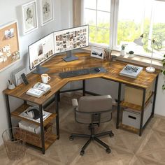 an office desk with multiple computer screens and pictures on the wall, along with a chair