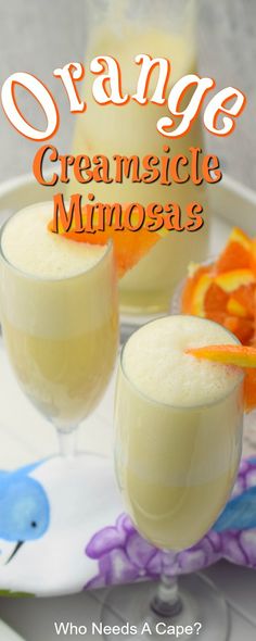 orange creamsice mimosa recipe on a plate with an orange garnish