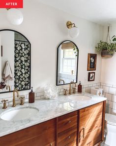 a bathroom with double sinks and two mirrors on the wall next to eachother