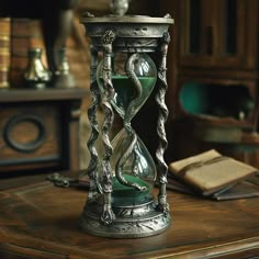 an hourglass sitting on top of a wooden table