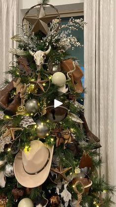 a christmas tree decorated with hats and ornaments