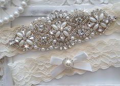 "This beautiful Wedding Garter Set is made with fine stretch lace (shown in ivory). The jewel is made with numerous high quality glass crystals and pearls. Matching toss garter features a satin ribbon bow and a pearl embellishment. Very sparkly and much more beautiful in person. LACE: Measures 1.5\" Measurement: Select your thigh measurement in the Size drop-box at checkout. To measure your thigh, use a soft measuring tape and place it where you would like to wear your keepsake garter. You can u Fitted White Crystal Bridal Accessories, Elegant Lace Bridal Accessories For Wedding, Elegant Lace Bridal Accessories For Marriage, Elegant Lace Bridal Accessories, Thigh Measurement, Pearl Embellishment, Bridal Garters Set, Wedding Garter Set, Wedding Garters