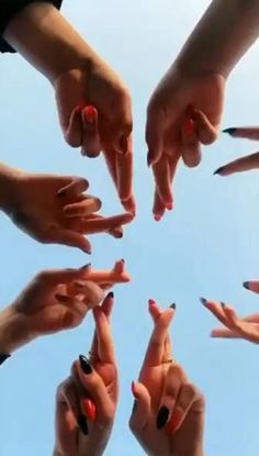 many hands reaching for each other in the air