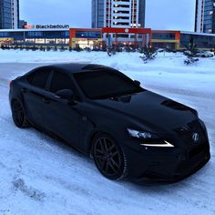 a black car is parked in the snow