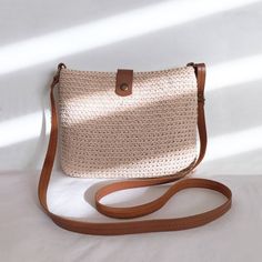 Handmade Trendy and modern crochet bag DETAILS Material: Textile yarn 80% cotton 20% polyester Dimensions: 23×18.5×2.5 cm (9''x7.25''x1'') Color beige With leather lid, long leather straps 120cm (47'') Metal color bronze With inner lining Additional information on care Washable at 30o Dry on a horizontal surface Don't tweak or twist All bags are made in a smoke and pet free room. Please note that colors may vary slightly from photos due to different monitor settings. Brown Woven Leather Crochet Bag For Daily Use, Brown Leather Woven Crochet Bag For Daily Use, Daily Use Brown Crochet Bag With Woven Leather, Casual Crochet Satchel Bag With Woven Leather, Beige Crochet Satchel Bag With Adjustable Strap, Bohemian Woven Leather Crochet Shoulder Bag, Beige Crochet Bag With Woven Leather For Everyday, Casual Crochet Shoulder Bag With Woven Leather, Everyday Beige Crochet Bag With Woven Leather