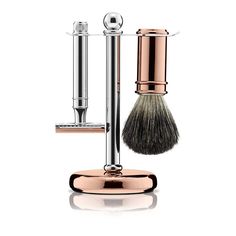 Chrome and Rose Gold 3 Piece Shaving Set. A timeless 3-piece shaving set for the discerning, modern gentleman. Comprising both the chrome and rose gold-plated double edge safety razor and the rose gold-plated shaving brush, made with silver tip bristles and presented on a luxurious stand. Made in England to the highest standard, this shaving set will make a stylish addition to any bathroom and is essential for achieving the perfect wet shave at home. #croftonandhall #giftforhim #shavingkit Rose Gold Plate, London Gifts, Shaving Set, Smooth Shave, Safety Razor, Modern Gentleman