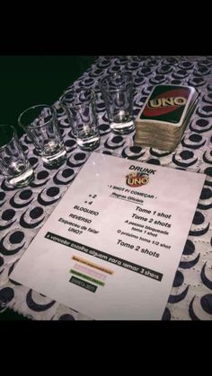 a table with glasses and menu on it