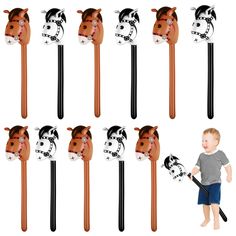 a little boy standing next to a set of toothbrushes with cows on them