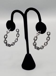 "​Stronger Together": An immovable row of gunmetal chain delicately twists into an edgy hoop for an intense industrial vibe. Earring attaches to a standard post fitting. Hoop measures approximately 1 3/4" in diameter. Sold as one pair of earrings. Stronger Together, Black Earrings, Last Call, Single Piece, Dog Tag Necklace, The Row, Twist, Chain, Black