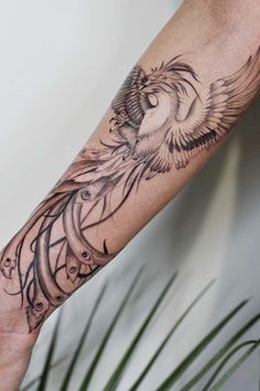 a man's arm with a tattoo on it and an eagle in the middle