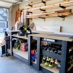 a workbench with lots of tools on it and shelves in the back ground