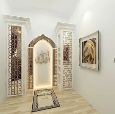 a room with white walls and wooden flooring has an archway between two doors that are decorated with intricate carvings