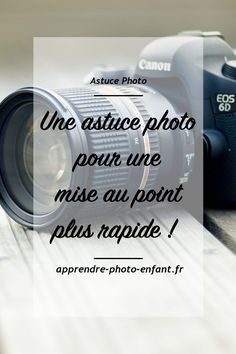 a camera sitting on top of a wooden table next to a quote about taking pictures