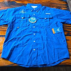 Description: Columbia Omni-Shade 50 Spf Men's Button Down, Short Sleeve, Dry Whicking Shirt In New Condition With Tags Attached. These Retail At $40.00 And Are Being Offered At Almost 1/2 Price! Great Summer Time Shirts! Size (From Tag) M Measurement (Approximate) Neck: 8.25" Arm Pit To Arm Pit: 24" Shoulder To Shoulder: 21.5" Hip To Hip: 24" Back Of Collar To Tail: 30" Arm Pit To Sleeve Cuff:6" Please Contact Me If Any Other Measurements Are Needed! Open To Offers! Outdoor Blue Top With Button Closure, Blue Outdoor Top With Button Closure, Blue Tops With Button Closure For Outdoor, Blue Collared Outdoor Shirt, Blue Collared Shirt For Outdoor, Blue Cotton Shirt For Outdoor, Mens Shirt Color, Columbia Shirt, Button Down Short Sleeve