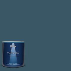 a can of marquee paint on a dark green background