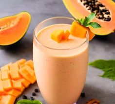 a smoothie is garnished with fresh fruit