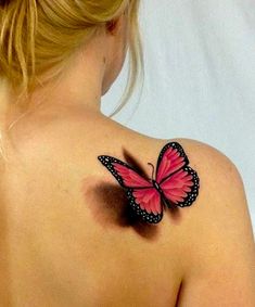 a woman with a pink butterfly tattoo on her back