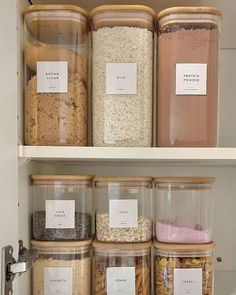 the pantry shelves are filled with various types of cereals and other things to put in them