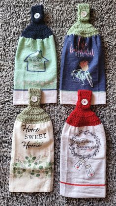 four hand towels are laid out on the floor, each with different designs and colors