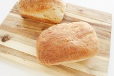 two loaves of bread on a cutting board