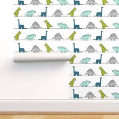 a wallpaper with dinosaurs on it and a roller blind in the background,