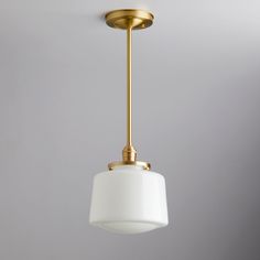 a white light hanging from a ceiling fixture