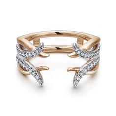 two tone gold and white diamond ring with an open design on the side, set in 18k rose gold