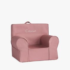 a pink children's chair with the word castle written on it, in front of a white background