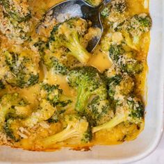 a casserole dish with broccoli and cheese