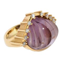 Enchanting 18 karat gold ring set with large amethyst and diamonds. By famous jewelry designer Cadeaux. 18 karat yellow gold, hallmarked Large, elegantly cut amethyst (shell-shaped) Set with 10 small diamonds Including certificate of authenticity. We adapt the ring size to your request. We also offer the matching bangle. The bangle is not included in the offer. You can find this under our other offers. Famous Jewelry Designers, Famous Jewelry, Gold Ring Sets, Amethyst Jewelry, Domed Ring, Diamond Gold, Precious Jewelry, Gem Stone, Certificate Of Authenticity