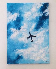 a painting of an airplane flying in the sky with blue and white clouds behind it