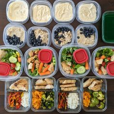 several plastic containers filled with different types of food