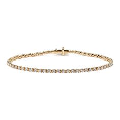 Turn heads with this stunning lab-grown diamond tennis bracelet. Set in warm 14-karat yellow gold  all the diamonds in this classic bracelet design are hand-matched for consistent color  clarity  and sparkle. A secure box clasp offers worry-free daily wear. Classic Diamond Gold Bracelet For Anniversary, Classic Round Diamond White Gold Bracelet, Formal Classic Gold Bracelet With Single Cut Diamonds, Classic Gold Bracelet With Brilliant Cut, Classic Yellow Gold Tennis Bracelet With Single Cut Diamonds, Classic Gold Diamond Bracelet With Round Cut, Classic Yellow Gold Diamond Bracelet With Single Cut Diamonds, Classic Gold Bracelet With Diamond White Prong Setting, Classic Yellow Gold Diamond Cut Tennis Bracelet