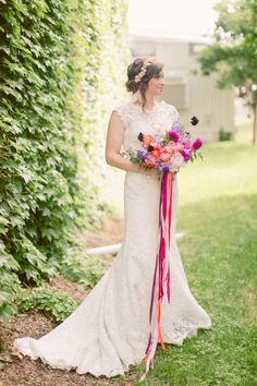 a woman in a wedding dress holding a bouquet