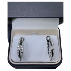 1.35ct Diamond Chunky Hoops Tennis Earrings 18ct White Gold These diamond hoops earrings are a must-have for any jewellery collection. With a total carat weight of 1.35ct and a brilliant cut main stone shape, these earrings are sure to catch the eye. The earrings are made of 18ct white gold and feature a pave setting style, with a total of 1.35ct diamonds and a fancy coloured diamond intensity. The diamond hoops earrings come with a certification of valuation and are not enhanced in any way. The earrings are round in shape and have a diamond closure. The main stone colour is white/colourless and the secondary stone is a diamond. These earrings are a great addition to any outfit and are perfect for any occasion. 1.35ct Round diamond large chunky huggies hoops earrings in 18ct white gold. Ch Tennis Earrings, Chunky Hoop Earrings, Hoops Earrings, Diamond Settings, Pave Setting, Diamond Hoop Earrings, Fancy Color Diamonds, Jewelry Earrings Hoops, Jewellery Collection