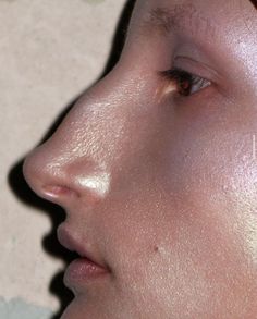 a woman's nose is shown with no makeup