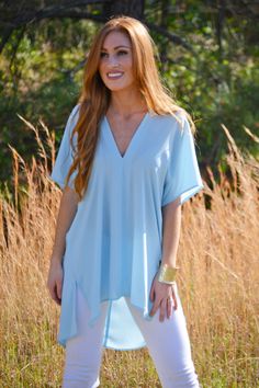 $69.00 BEST-SELLER, new color! This tunic is too dreamy to pass up. No really. It's that good. The fit is half way between flowing and boxy, so it looks great tucked in or worn loosely. Top features a v-neckline and hi-low hemline for a flowing fit. *also available in red Chic Blue V-neck Top For Summer, Solid V-neck Blouse For Layering, Chic Blue V-neck Top For Spring, Spring V-neck Top For Layering, Chic V-neck Tunic For Spring, Chic V-neck Top For Spring Layering, Summer V-neck Tunic With Relaxed Fit, Summer V-neck Relaxed Fit Tunic, Relaxed Fit V-neck Tunic For Summer