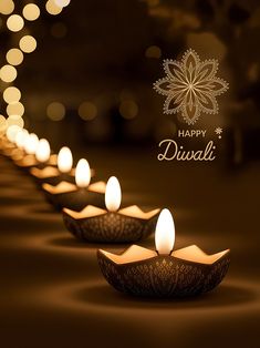 there are many lit candles in the shape of bowls with lights on them and an advertisement that says happy diwali