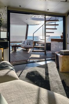 the inside of a boat with stairs leading up to it's deck and seating area