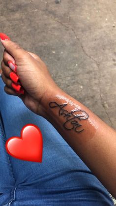 a woman's arm with a tattoo that reads, love is in the air