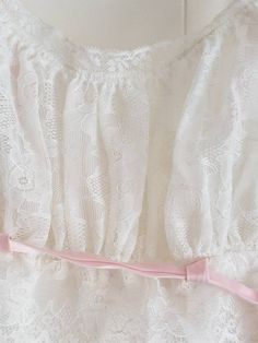 This is a vintage, Eyeful by Ruth Flaum, white, long nightie in a size 32 with pink trim. There is a discoloration and a mark on the garment. The interior label has a little cut in it. You can see this in the images. The price reflects this. All sales are final. This garment has the original tag. The sash has a metal ring at the end. The measurements are as follows: All measurements taken flat. Underbust 14 inches Don't forget to stop in at my other Etsy shop... http://www.etsy.com/shop/xtdesign White Lace Long Sleeve Nightgown, White Lace Trim Nightgown For Party, White Lace Spring Nightgown, White Lace Trim Party Nightgown, Women's Nightgowns, Pink Trim, Nightgowns, Metal Ring, Night Gown