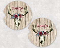 two coasters with flowers and antlers on them