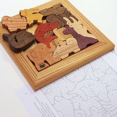 a wooden puzzle with animals on it