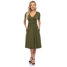 This dress features a V-neck design for a stylish and flattering look. Flattering Fitted V-neck Spring Dress, Fitted Flattering V-neck Spring Dress, Flattering V-neck Wrap Dress For Summer, Flattering V-neck Dress For Date Night, Flattering V-neck Summer Dresses, Casual Solid V-neck Midi Dress, Chic V-neck Solid Color Midi Dress, Chic Green V-neck Dress With Surplice Neckline, Solid Knee-length V-neck Dress For Spring