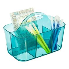 a blue plastic container with pens and money in it