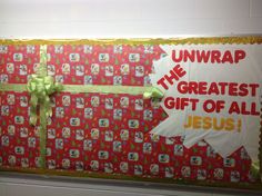 a bulletin board with the words unwrap the greatest gift of all jesus on it