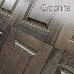 the words graphite are written on wooden doors with metal trimmings and wood grained panels