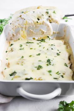 white chicken enchiladas with cream cheese in a casserole dish