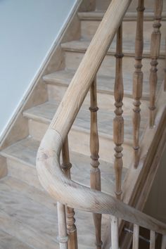 an old wooden staircase with handrails and spindles