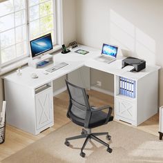 a computer desk with two computers on it and a printer in the corner next to it